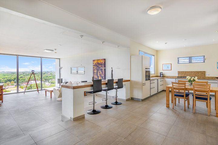 Located in one of the highest residential areas in Damacor, Curaçao, this exclusive villa offers a rare combination of privacy, space, and breathtaking panoramic views. image